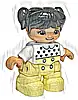 Minifigurka LEGO® 47205pb069 Duplo Figure Lego Ville, Child Girl, Bright Light Yellow Legs, White Top with Black Hearts, Black Hair with Pigtails, Medium Nougat Skin